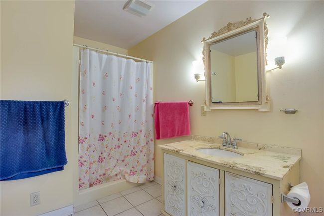 Master Bathroom featuring vanity, a shower with curtain, and tile patterned floors | Image 13