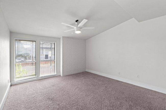 Empty room featuring a ceiling fan, carpet floors, and baseboards | Image 17