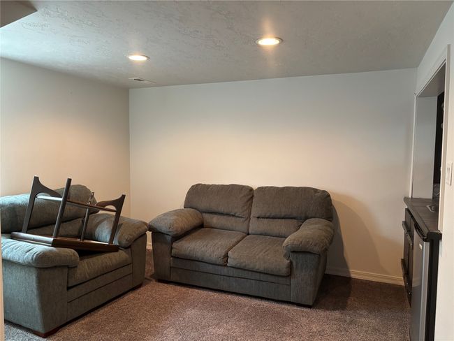Living area with carpet floors, recessed lighting, baseboards, and a textured ceiling | Image 20