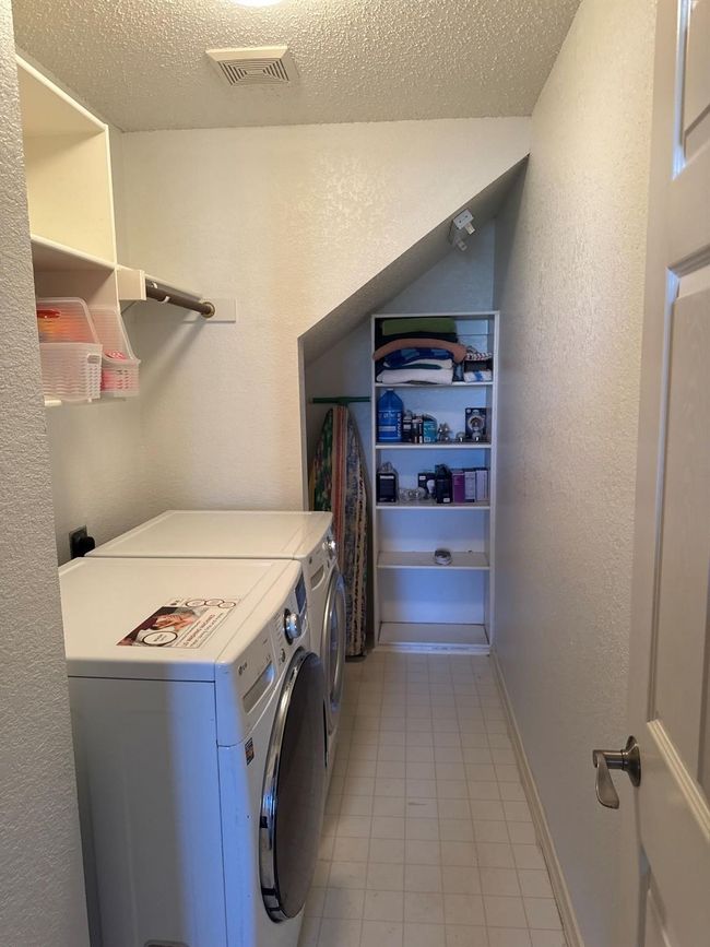 The Laundry Room boasts handy built-in shelving. | Image 22