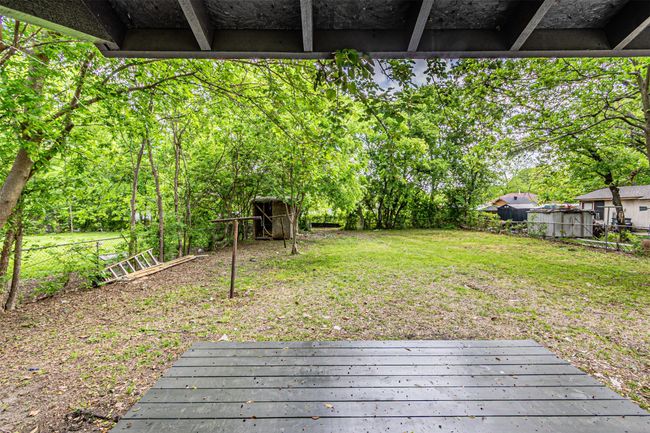 Wooden deck featuring a fenced backyard | Image 23