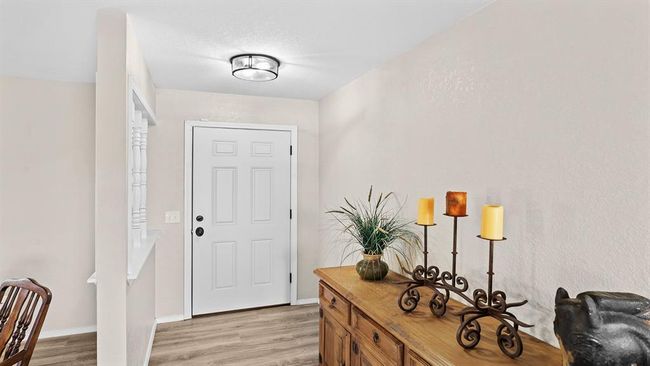 Doorway with baseboards and light wood-type flooring | Image 27