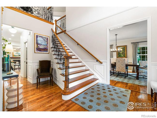 Open Layout. Front Entrance opens to Dining and Living Rooms. Hardwood Floors and Custom Iron Railings. | Image 4