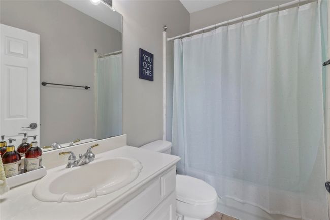 Full bath featuring vanity and shower / bathtub combination with curtain | Image 25