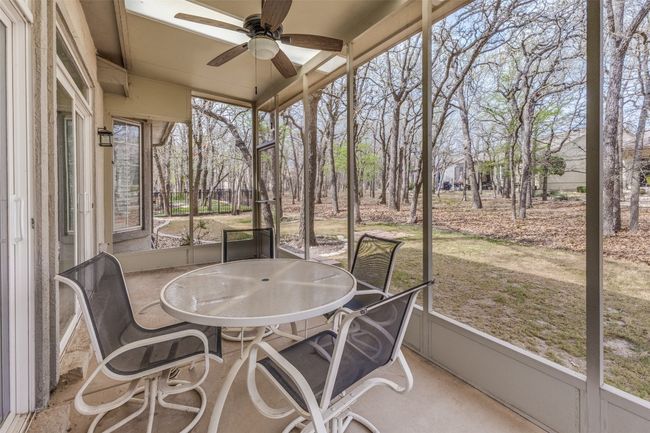 Sunroom / solarium featuring outdoor dining space and ceiling fan | Image 22