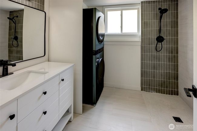 Laundry room with 3/4 bath. | Image 19