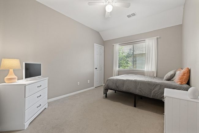 Whether used for family, guests, or a home office, the secondary bedrooms are quiet, well-proportioned, and easy to make your own | Image 26