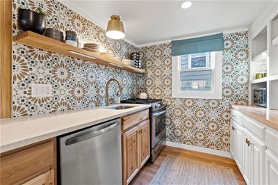 Beautifully redone kitchen with new appliances. | Image 3