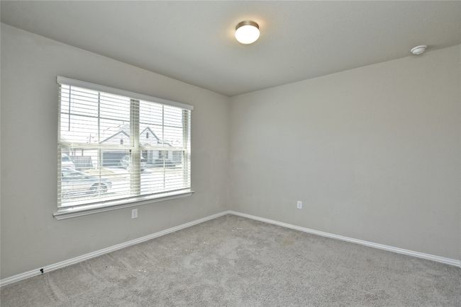 Carpeted empty room featuring baseboards | Image 18