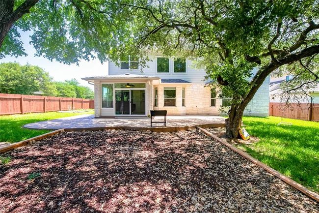 Back of property with ceiling fan, a patio area, and a fenced backyard | Image 31
