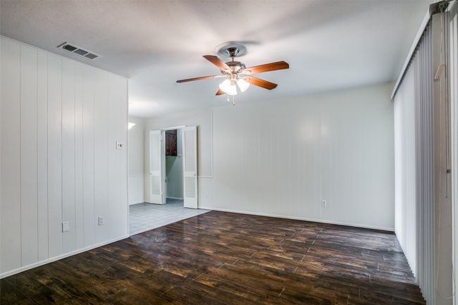 Living room featuring hardwood / wood-style floors/fireplace and a ceiling fan | Image 4