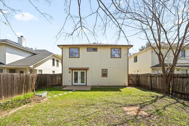 Back of property with a fenced backyard, french doors, and a yard | Image 30