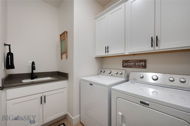 Laundry room with sink and storage | Image 19