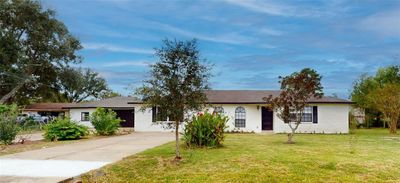 1905 County Rd 235, Alvin, TX Beautiful fully remodeled home with white brick & black accents on doors and window exterior shutters, new roof with warranty. | Image 1