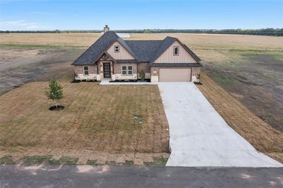 View of front of house featuring a garage and a rural view | Image 2