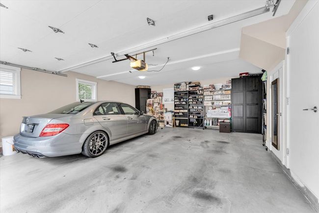 Garage featuring a garage door opener | Image 26
