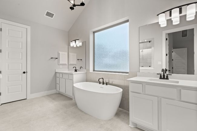Primary Bath retreat with dual vanities & soaking tub | Image 21