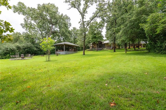 Yard with covered dining/gathering area | Image 10