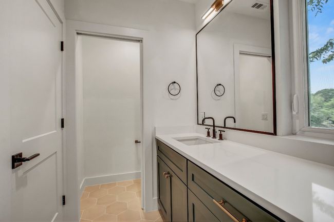 Bathroom featuring vanity, tile patterned floors, and baseboards | Image 18