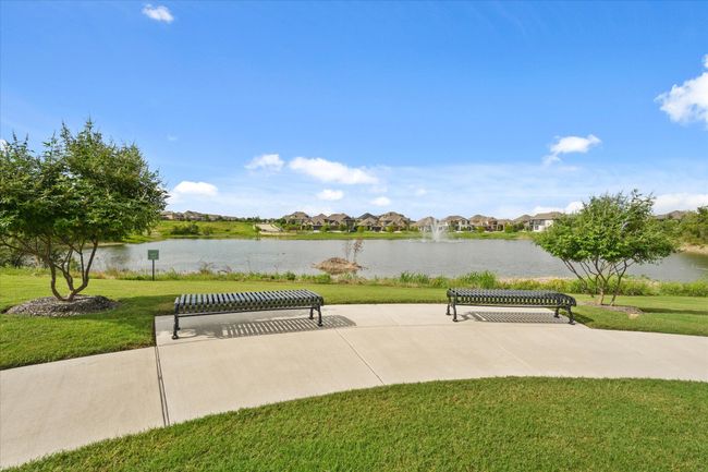 View of property's community with a water view, a lawn, and a residential view | Image 30