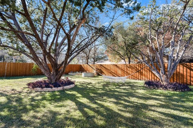 View of fenced backyard | Image 22