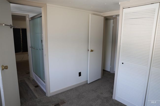 Unfurnished bedroom featuring a closet and carpet floors | Image 13