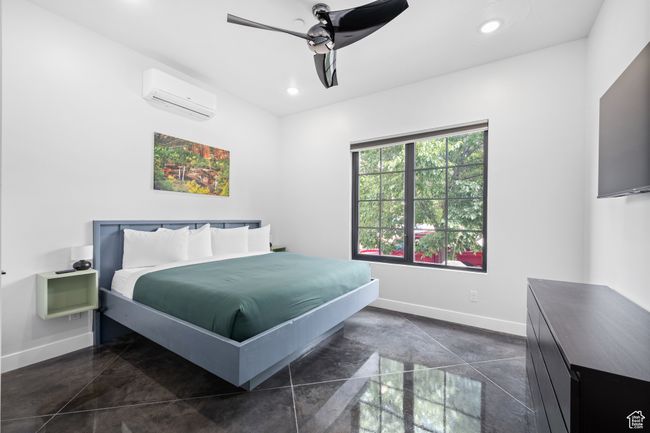 Bedroom featuring ceiling fan and a wall unit AC | Image 12