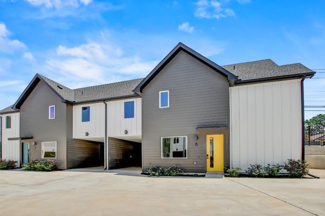 View of front facade with a shingled roof, board and batten siding, and driveway | Image 31