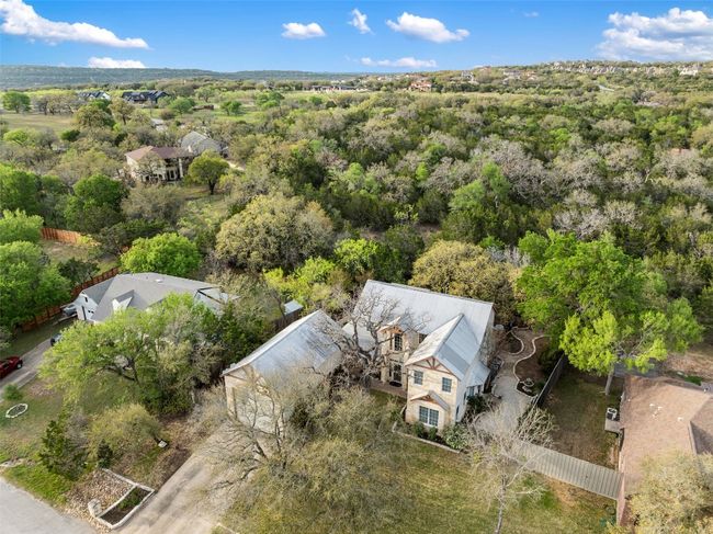 This lovely home is surrounded by green space. | Image 35