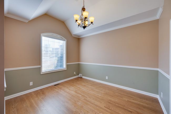 Imagine the warmth of a family gathering in your formal dining room. | Image 9
