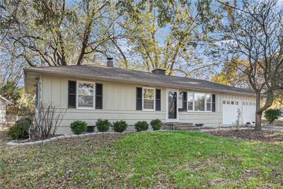 Ranch-style home with a garage and a front yard | Image 3