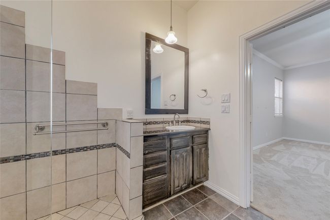 Full bath featuring vanity, crown molding, and baseboards | Image 24