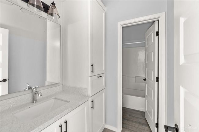 Bathroom featuring vanity and wood finished floors | Image 7