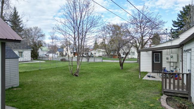 View of yard featuring fence and a residential view | Image 40