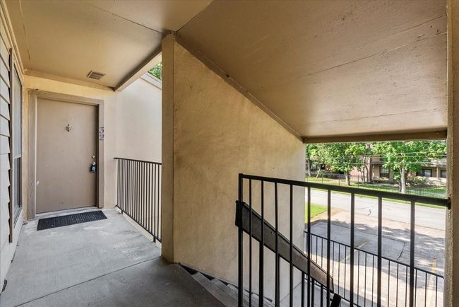 View from stairway outside condo, highlighting surroundings | Image 24