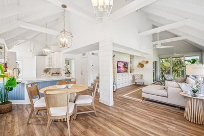 View of open concept kitchen/dining/living room from entry way. Gorgeous shiplap ceilings! | Image 3