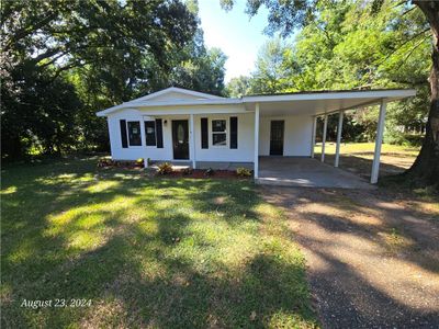 View of front of home with a front lawn and a carport | Image 2