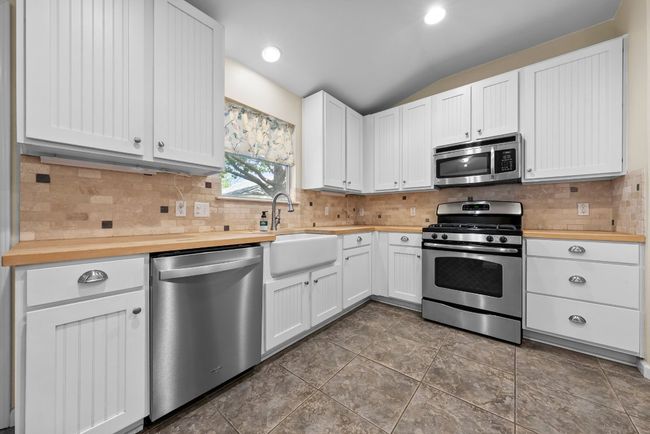 Butcher block counter tops with farm style sink | Image 24