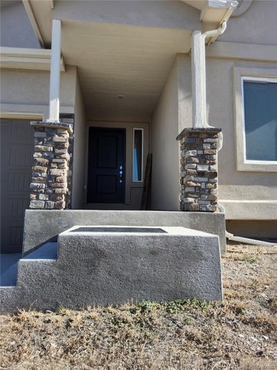 Deep covered front porch waiting for your holiday decorations | Image 3