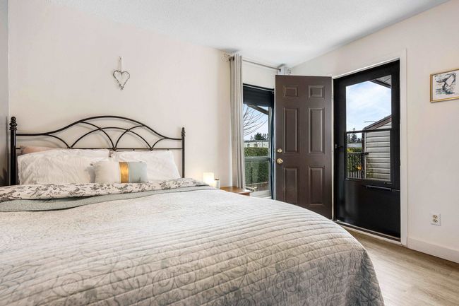 Bedroom featuring access to outside, light wood-style floors, and baseboards | Image 17