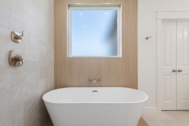 Full bathroom featuring a freestanding bath | Image 19