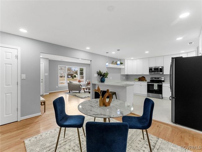 Dining area featuring baseboards, recessed lighting, and light wood-style floors | Image 17