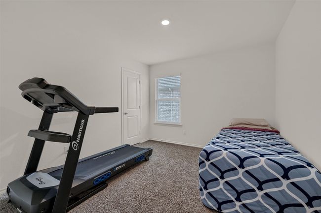 Workout room with carpet and baseboards | Image 24