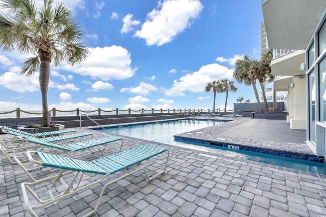 Community pool featuring a patio area | Image 27
