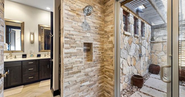 MASTER BATH WITH LARGE WALKIN AND WALKOUT SHOWER. | Image 16