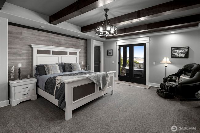 Primary room on main floor of home with french doors to outside hot tub! | Image 11