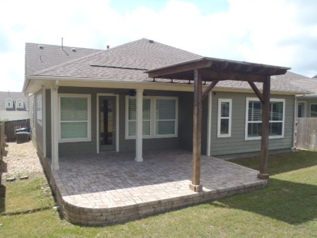 Rear view of property featuring a fenced backyard, a patio, and a shingled roof | Image 9