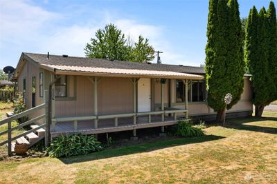 Home front with welcoming covered porch. | Image 3