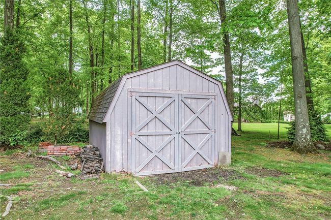 Storage shed for outdoor equipment. | Image 44