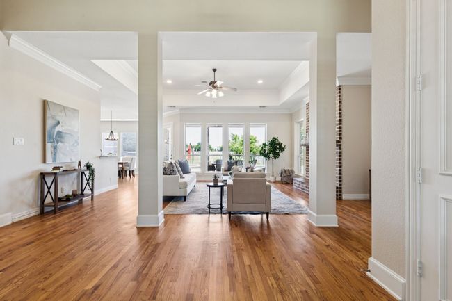 The entry to the home flows into the stunning living room making it a bright and welcoming space to greet friends and family. | Image 5